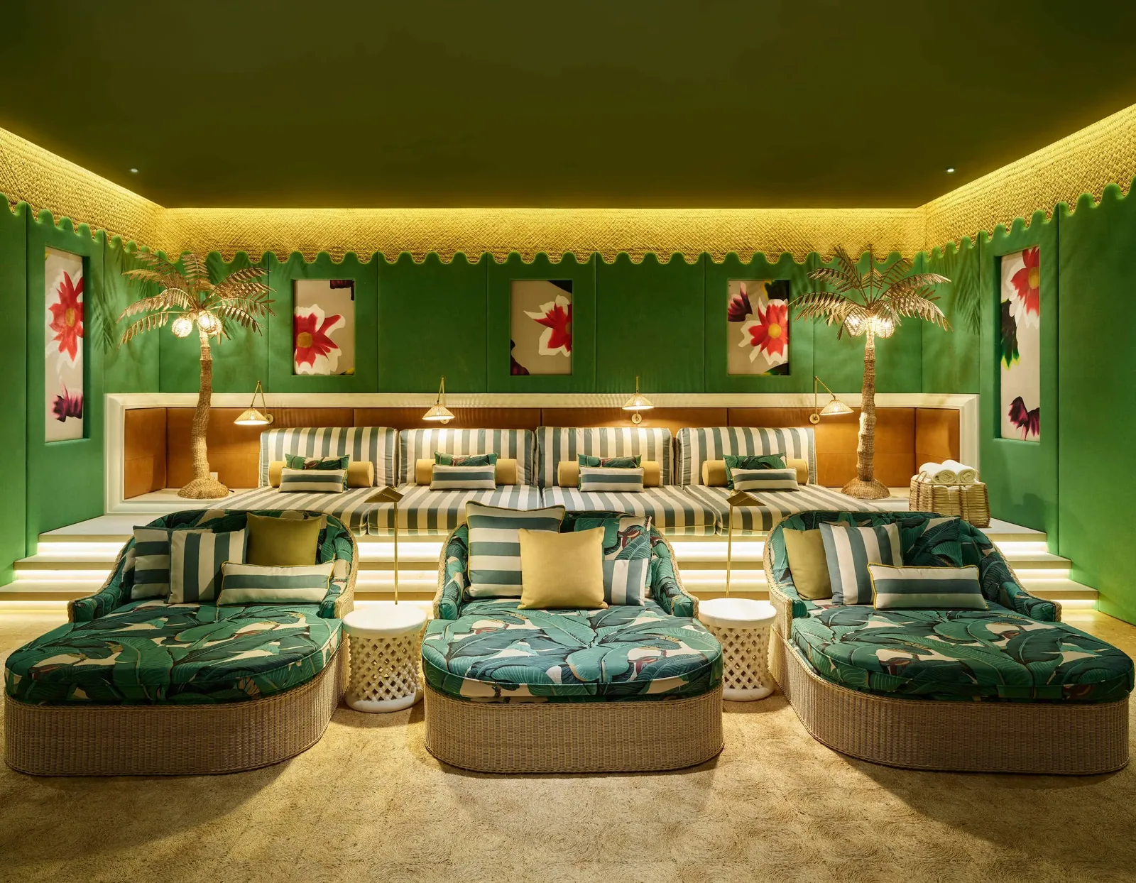 The private cinema&rsquo;s tiered daybeds, upholstered in green palm print