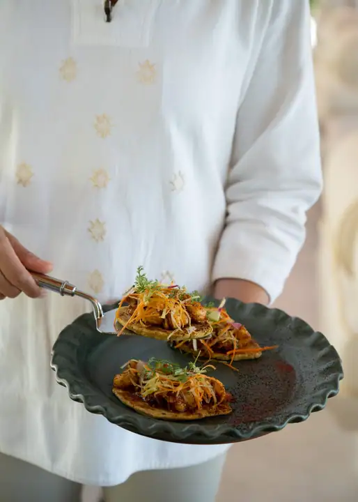 A plate of ceviche tostadas carried out to the pool