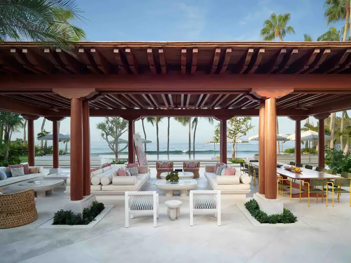 The covered oceanfront pavilion and the lava-tiled pool beyond